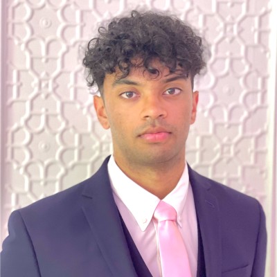 Head and shoulders of man in suit and tie.